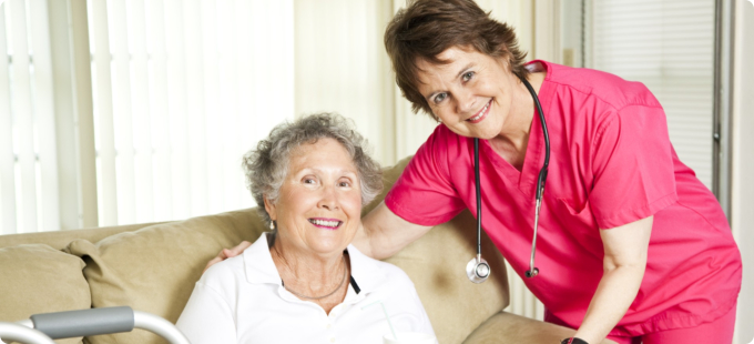 caregiver smiling with her patient